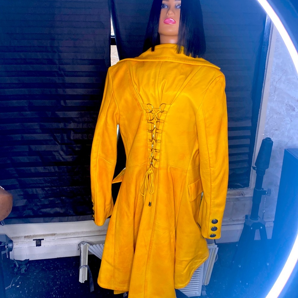 Gold high low leather coat with pea coat style buttons down the front